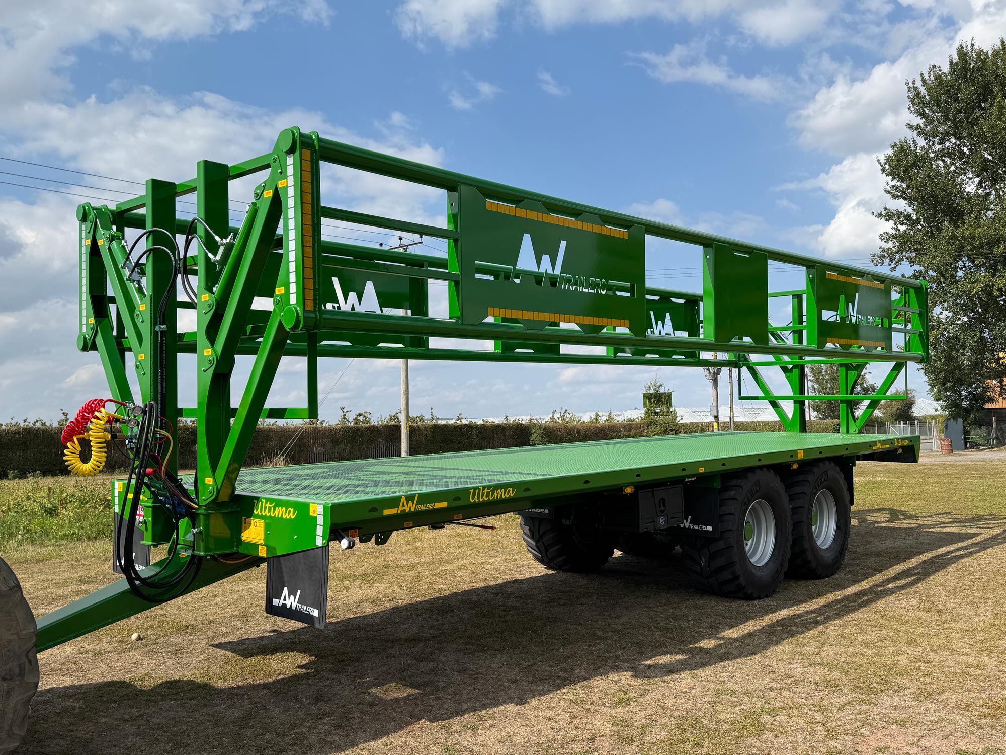 Green trailer in a field