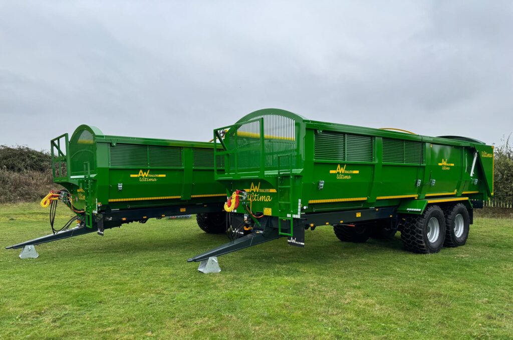 Large green trailer in a field