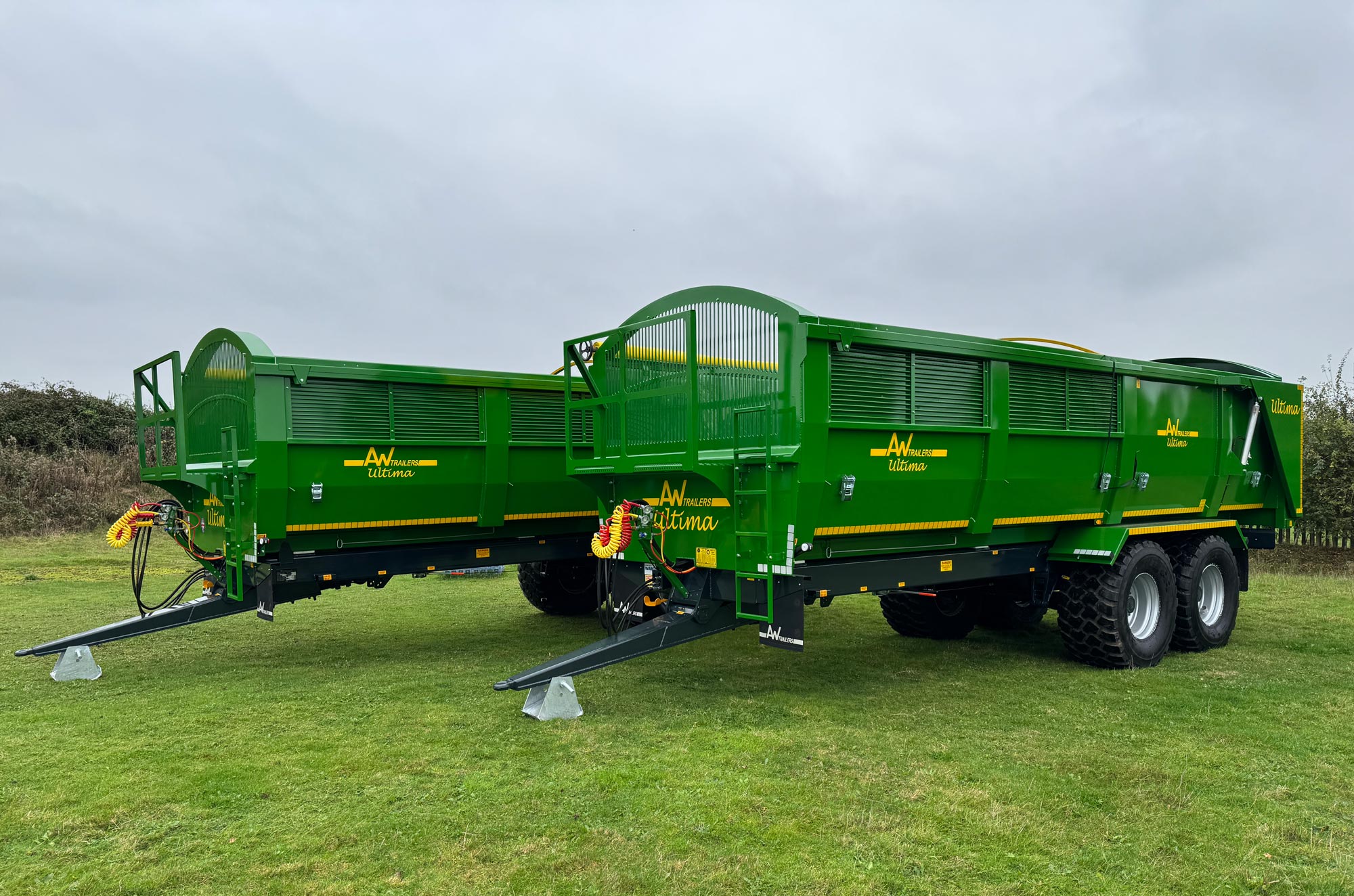 Large green trailer in a field