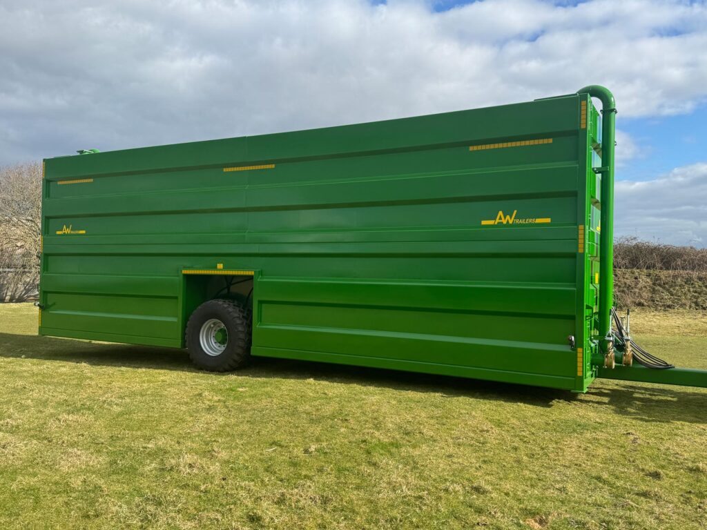 A Large green tank in a field