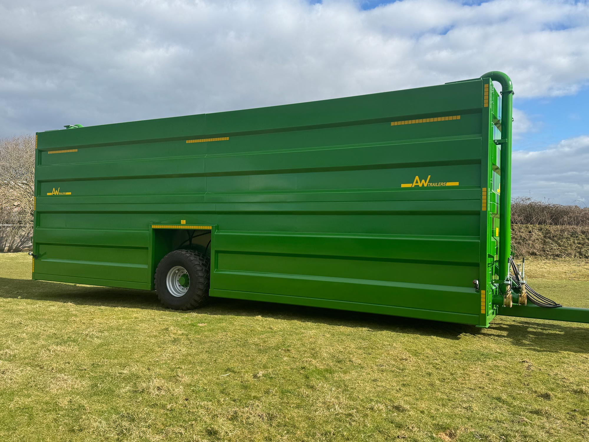 A Large green tank in a field