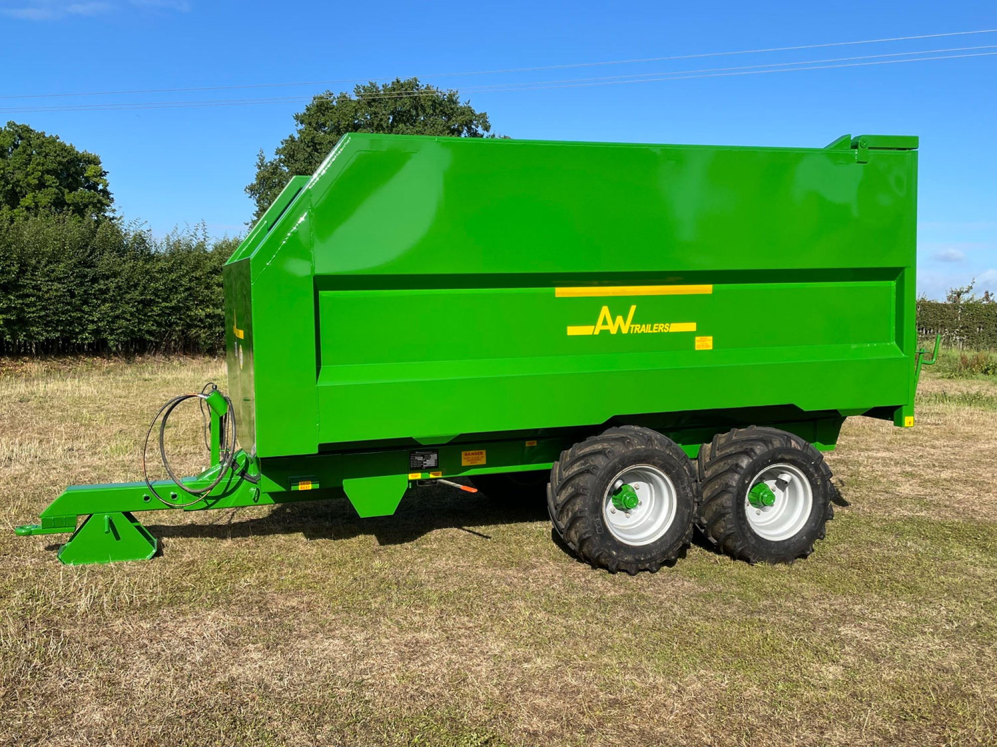 Large green trailer in a field