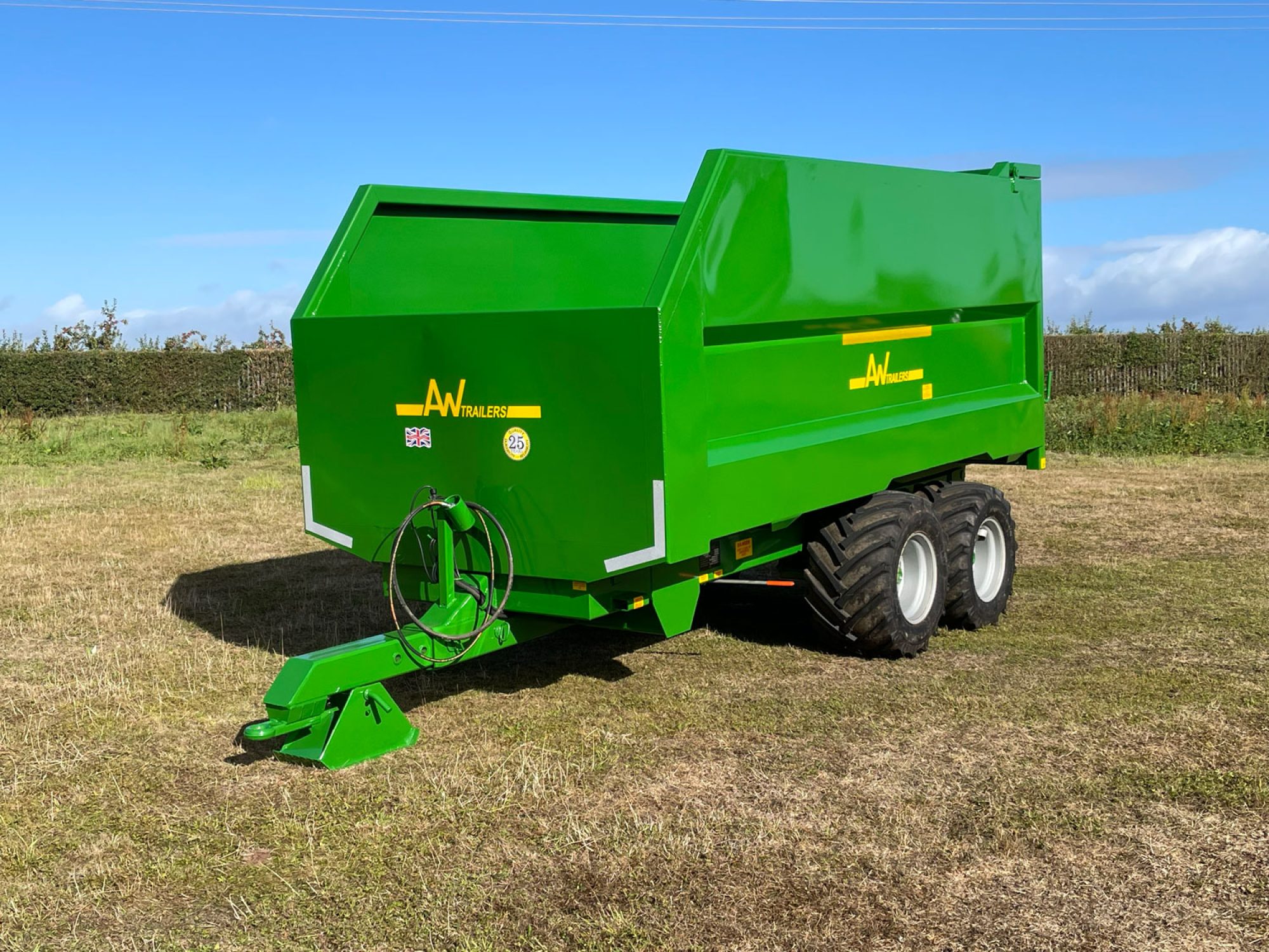 Large green trailer in a field
