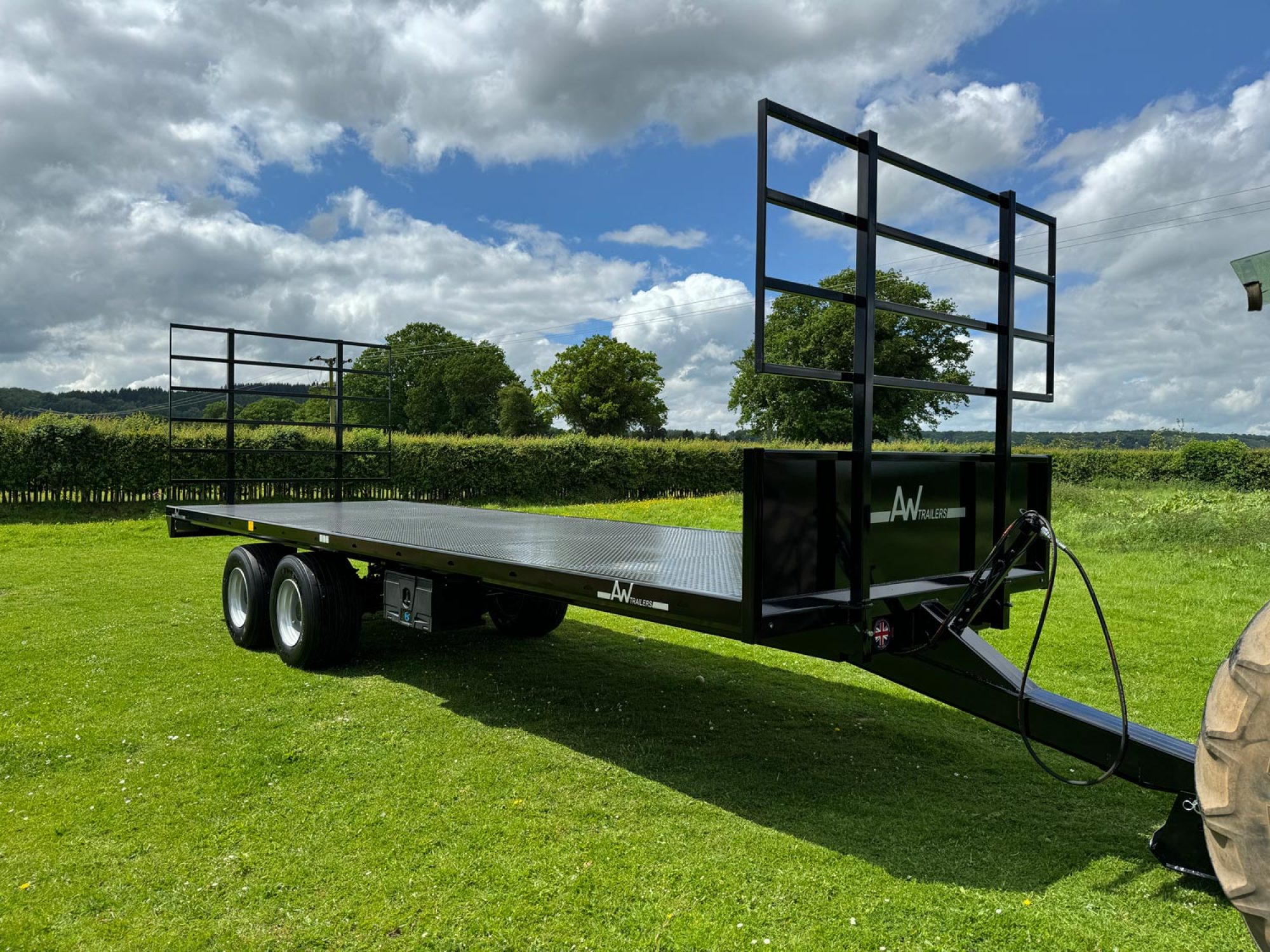 Black bale trailer in a field