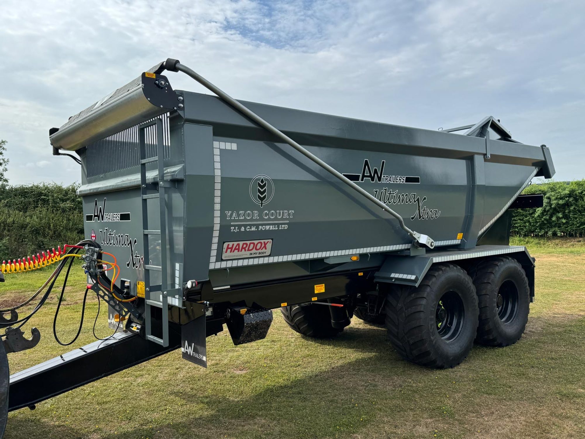 A large grey trailer in a field