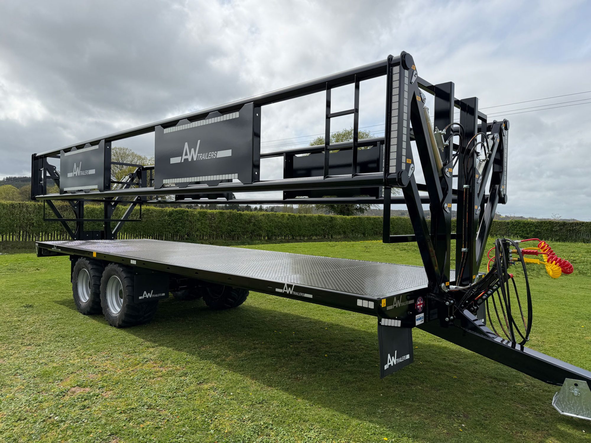 A black trailer in a field