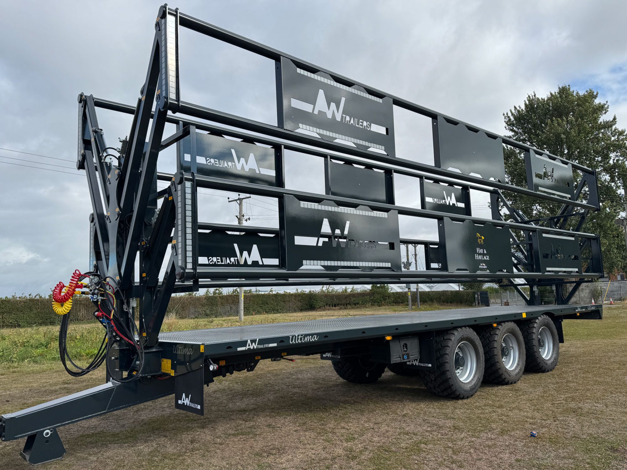 A black trailer in a field