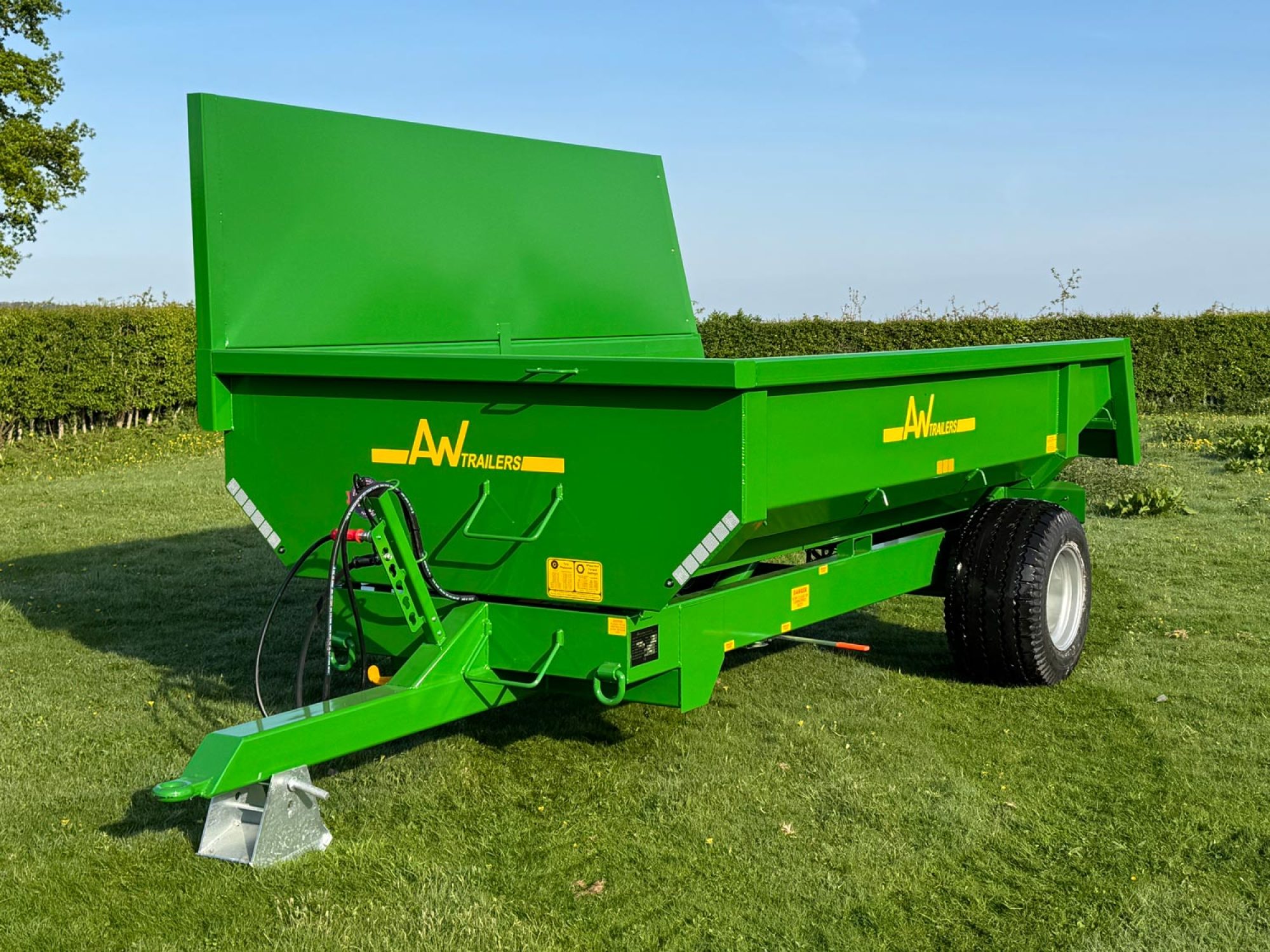Large green trailer in a field