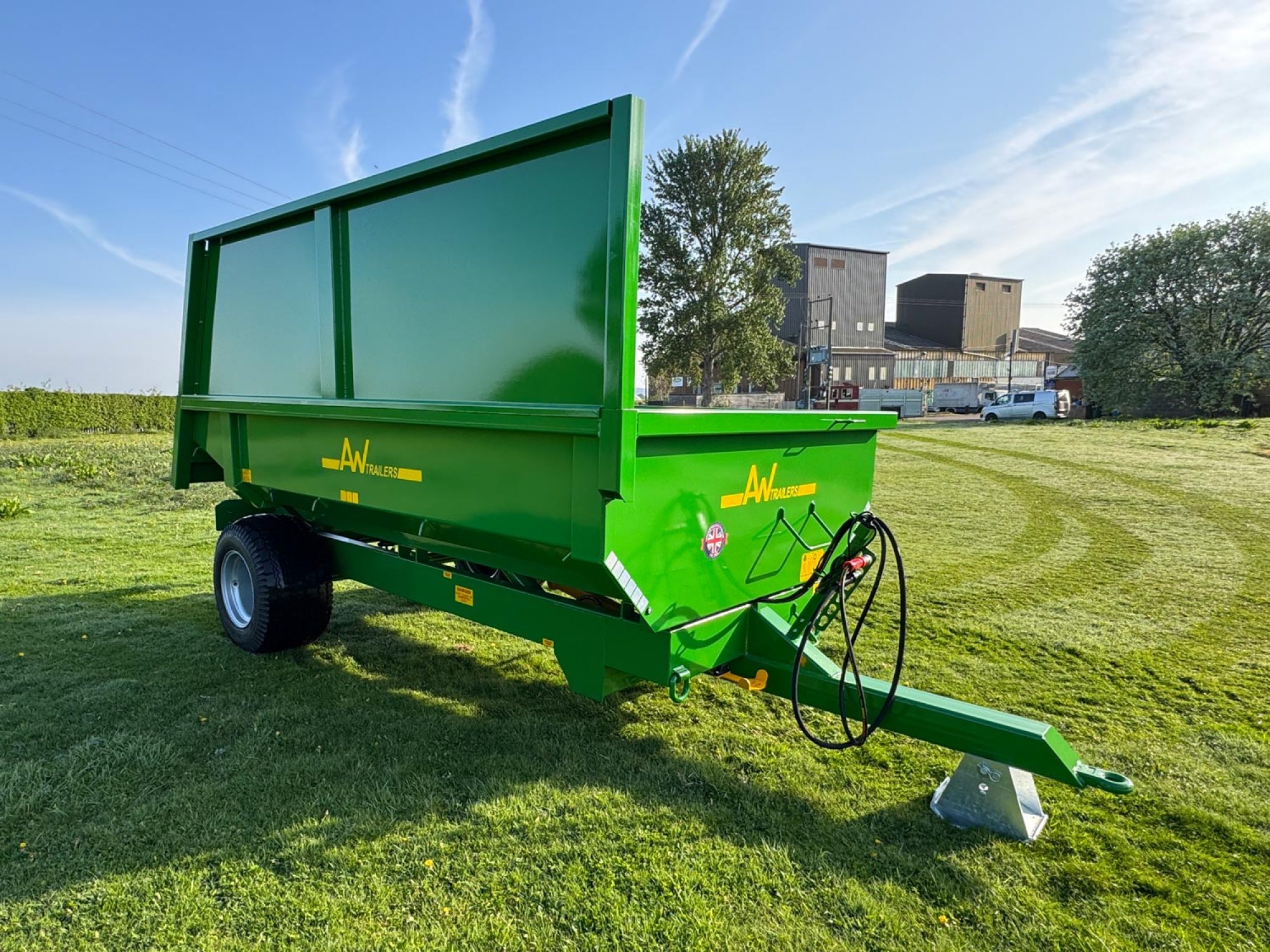 Large green trailer in a field