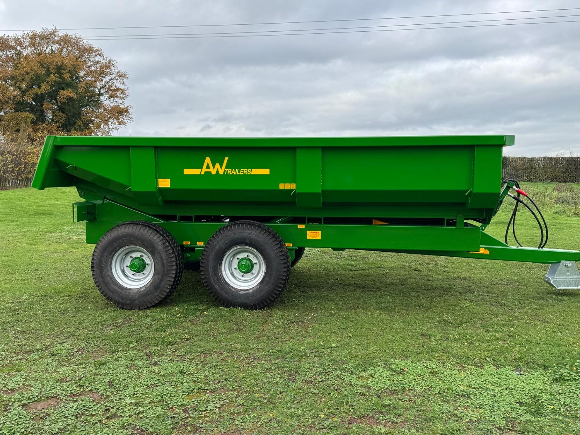 Large green trailer in a field