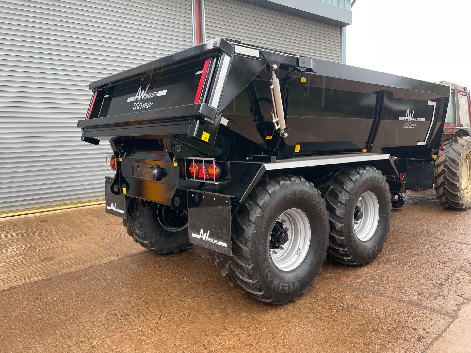 Back of a black trailer in a car park