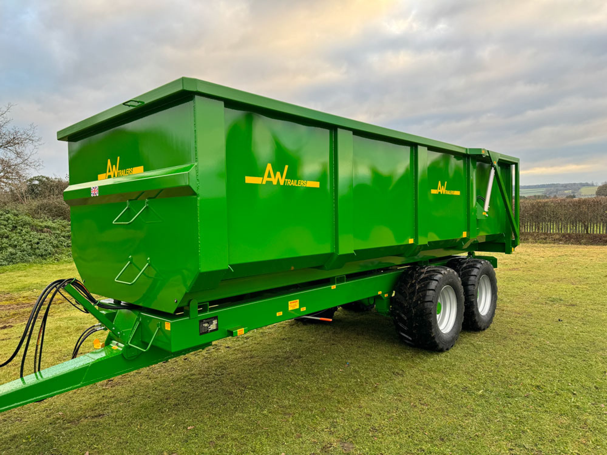 Green trailer in a field