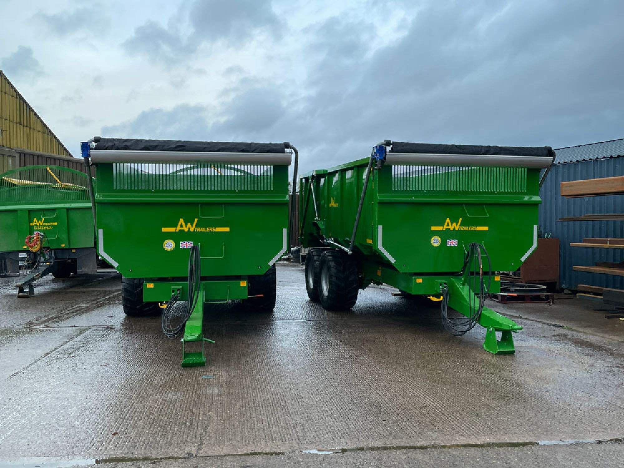 2 green trailers in factory