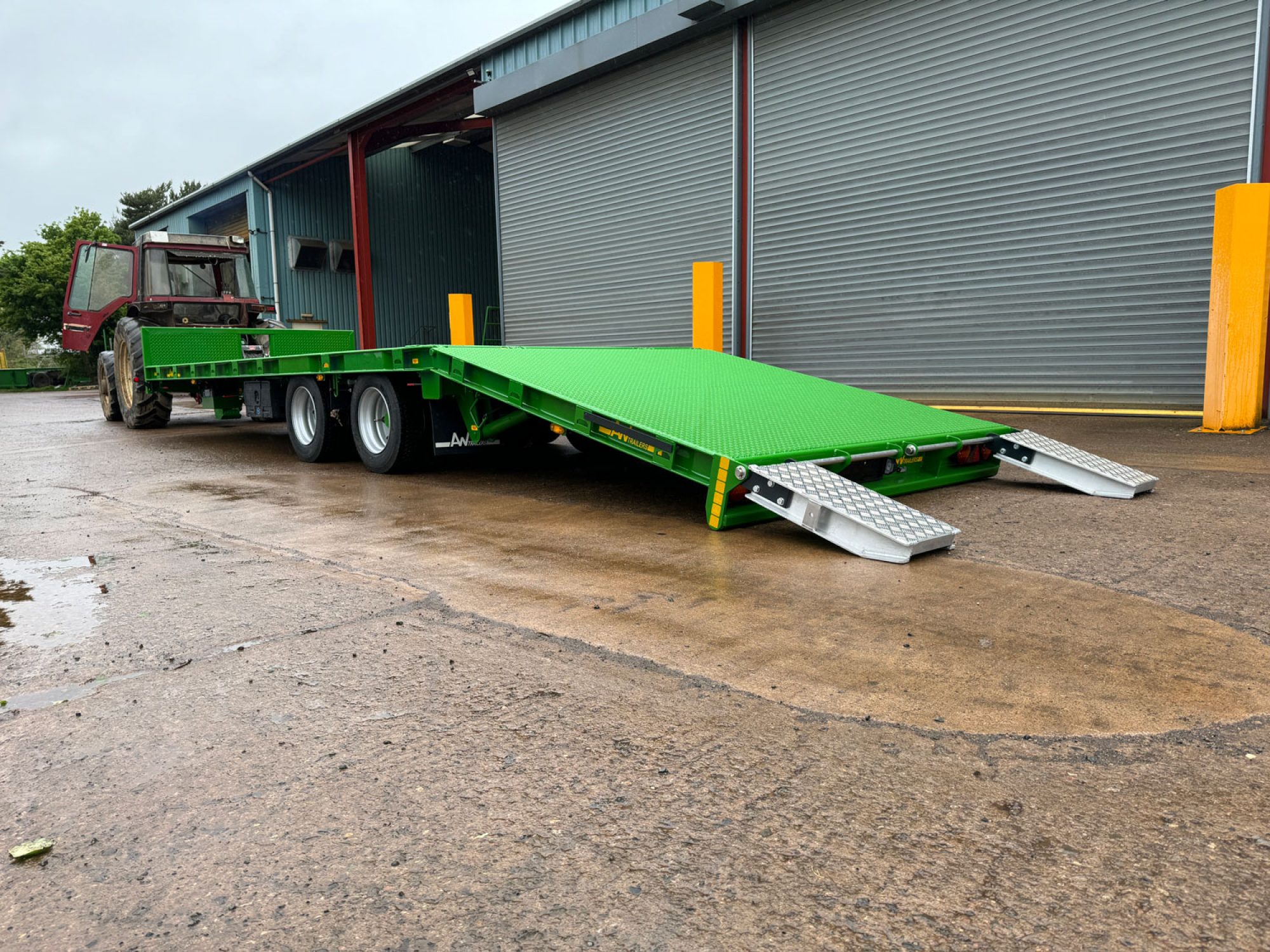Plant Lowloader trailer in green in a car park