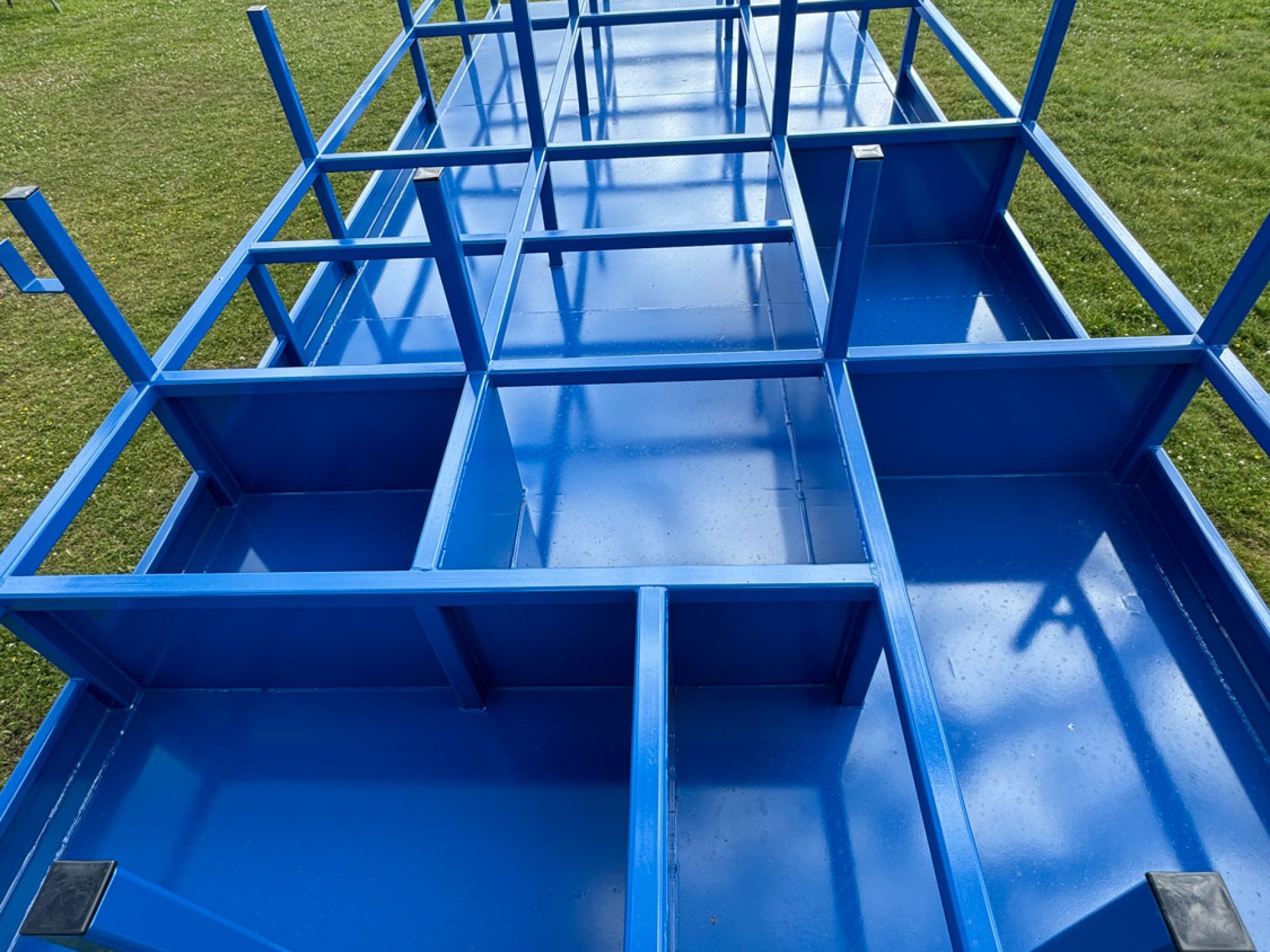 Blue scaffold trailer in a field