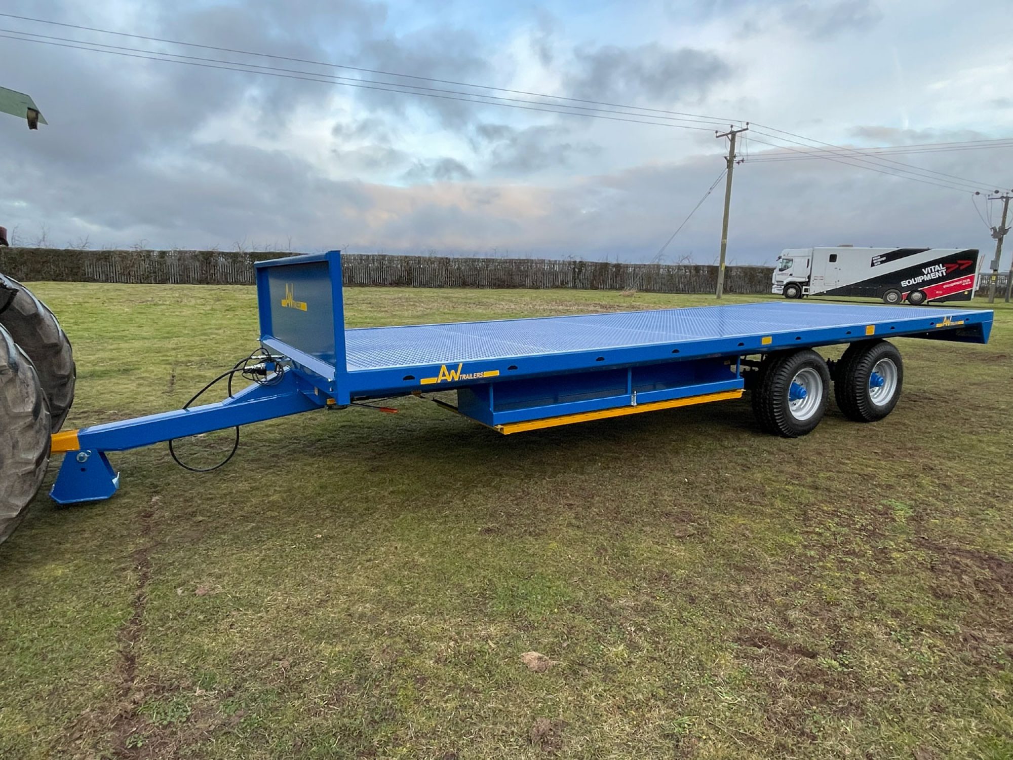 Blue scaffold trailer in a field