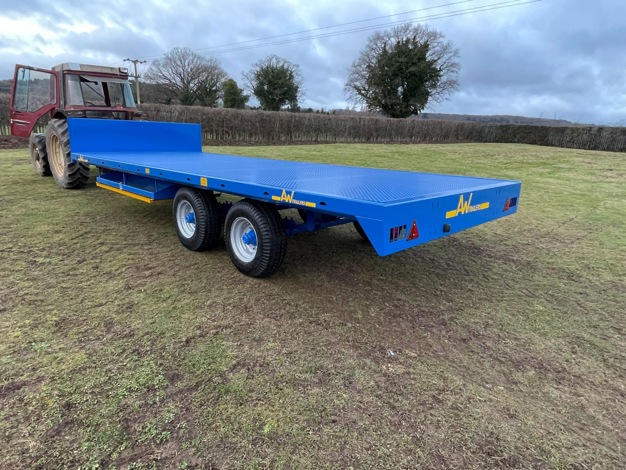 Blue scaffold trailer in a field