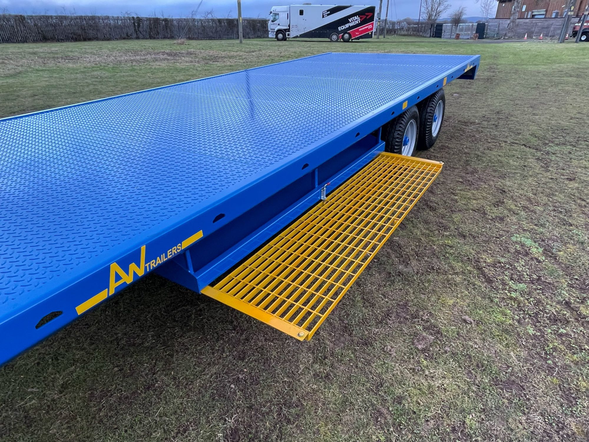 Blue scaffold trailer in a field