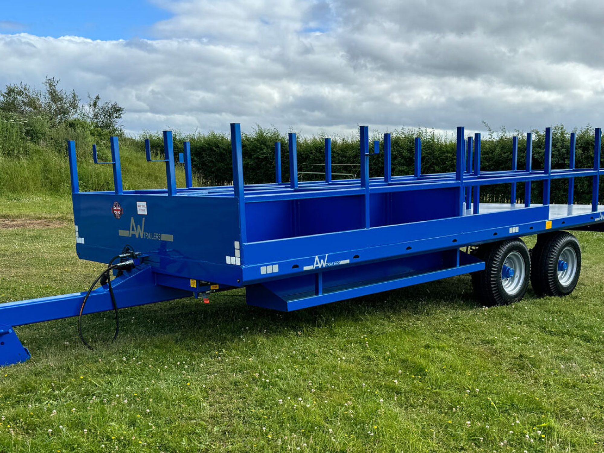 Blue scaffold trailer in a field