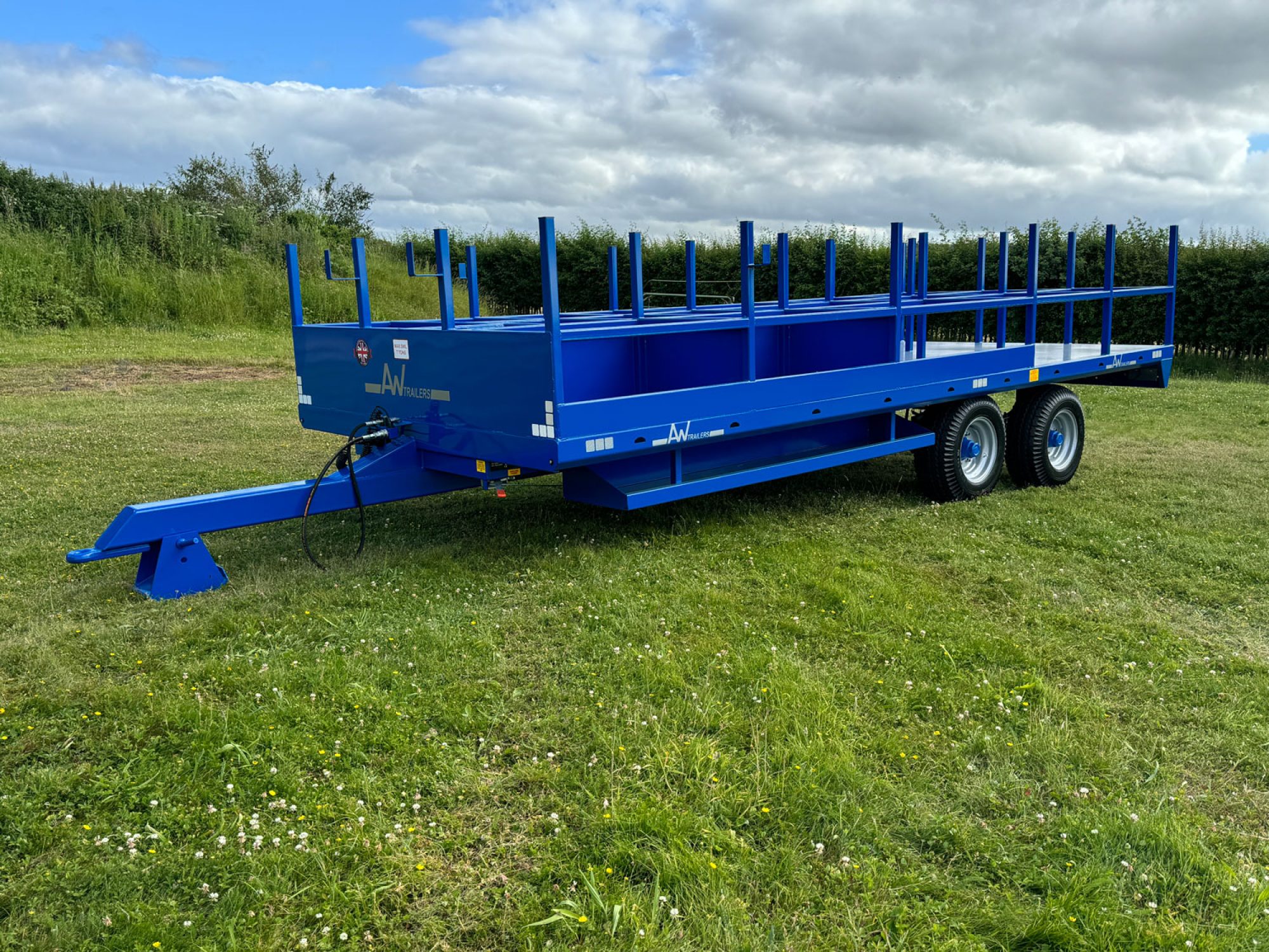Blue scaffold trailer in a field