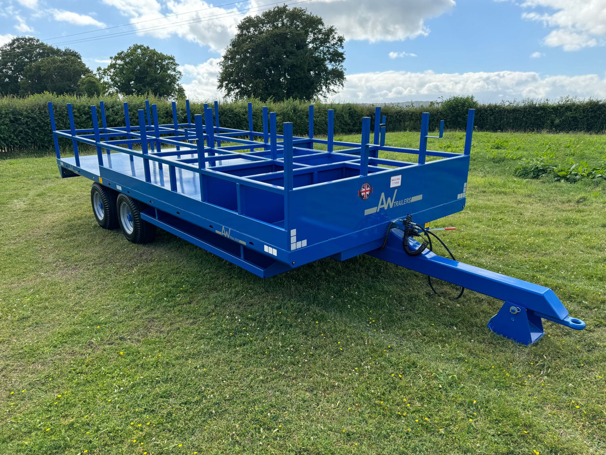 Blue scaffold trailer in a field