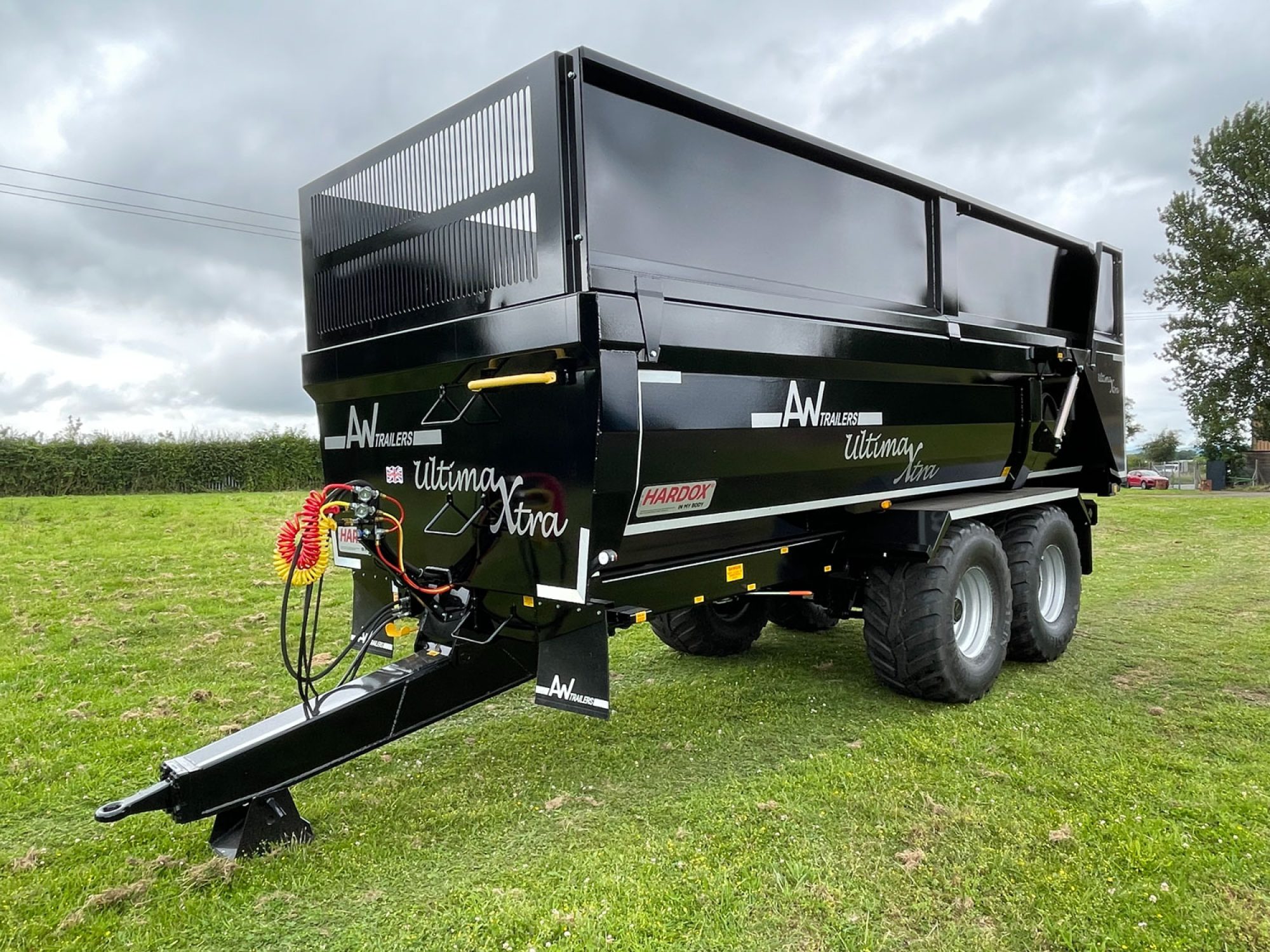 Black Stone & Rubble Trailer in a field