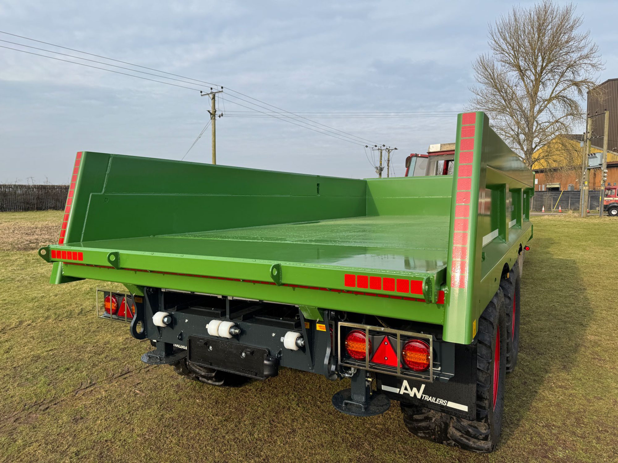 Green Stone & Rubble Trailer in a field