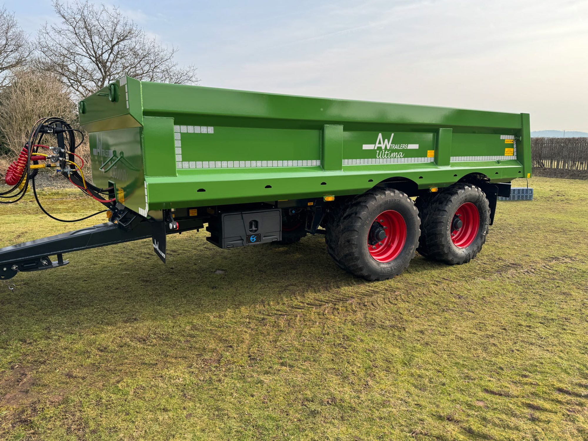 Green Stone & Rubble Trailer in a field
