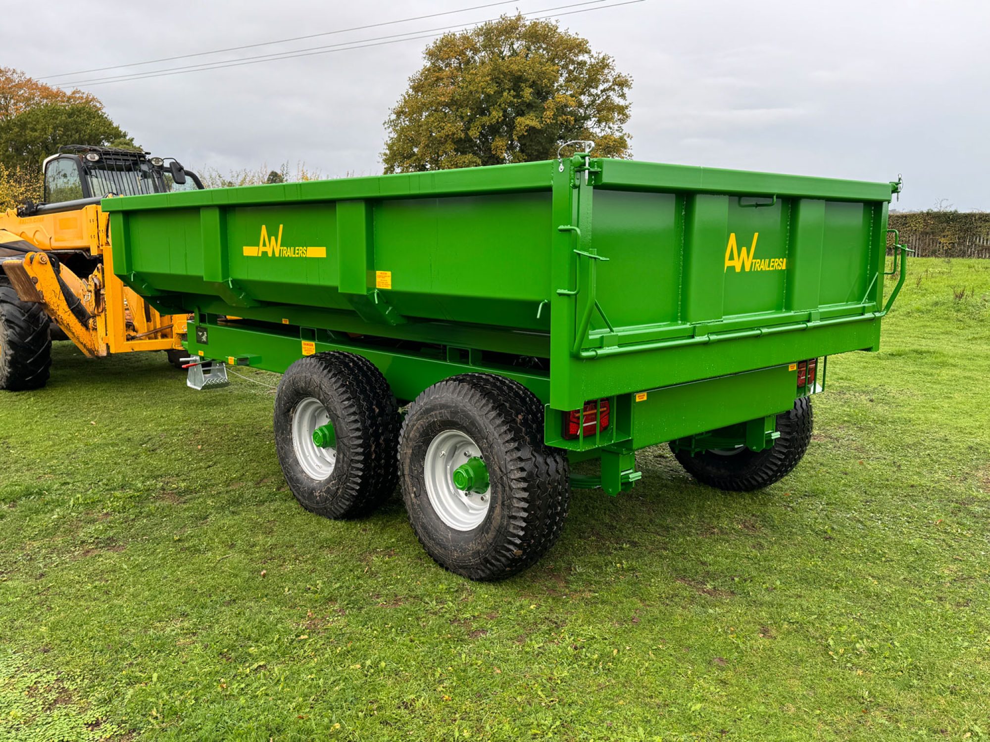 Green Stone & Rubble Trailer in a field