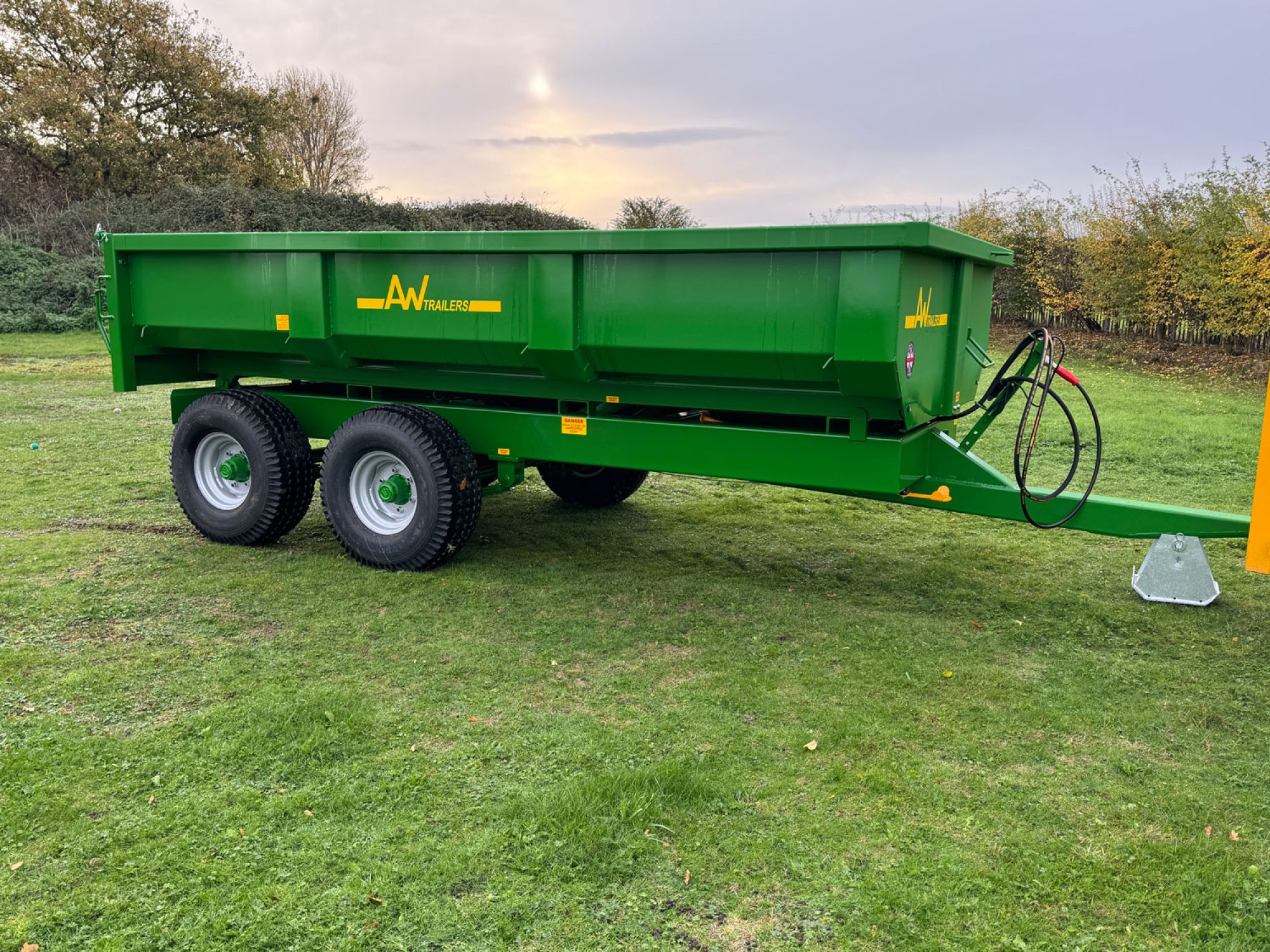 Green Stone & Rubble Trailer in a field