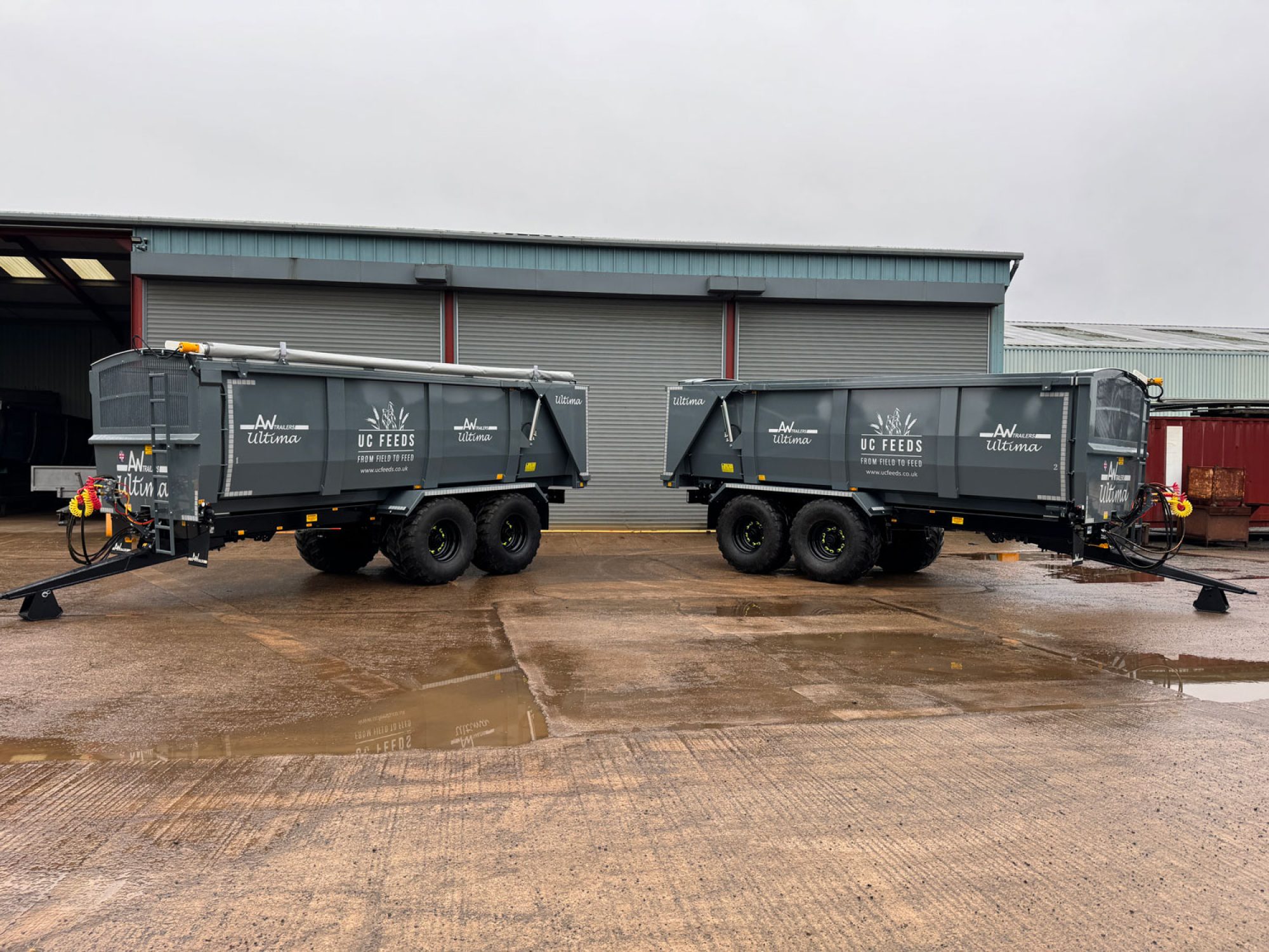 2 large grey ultima monocoque trailers in a factory carpark