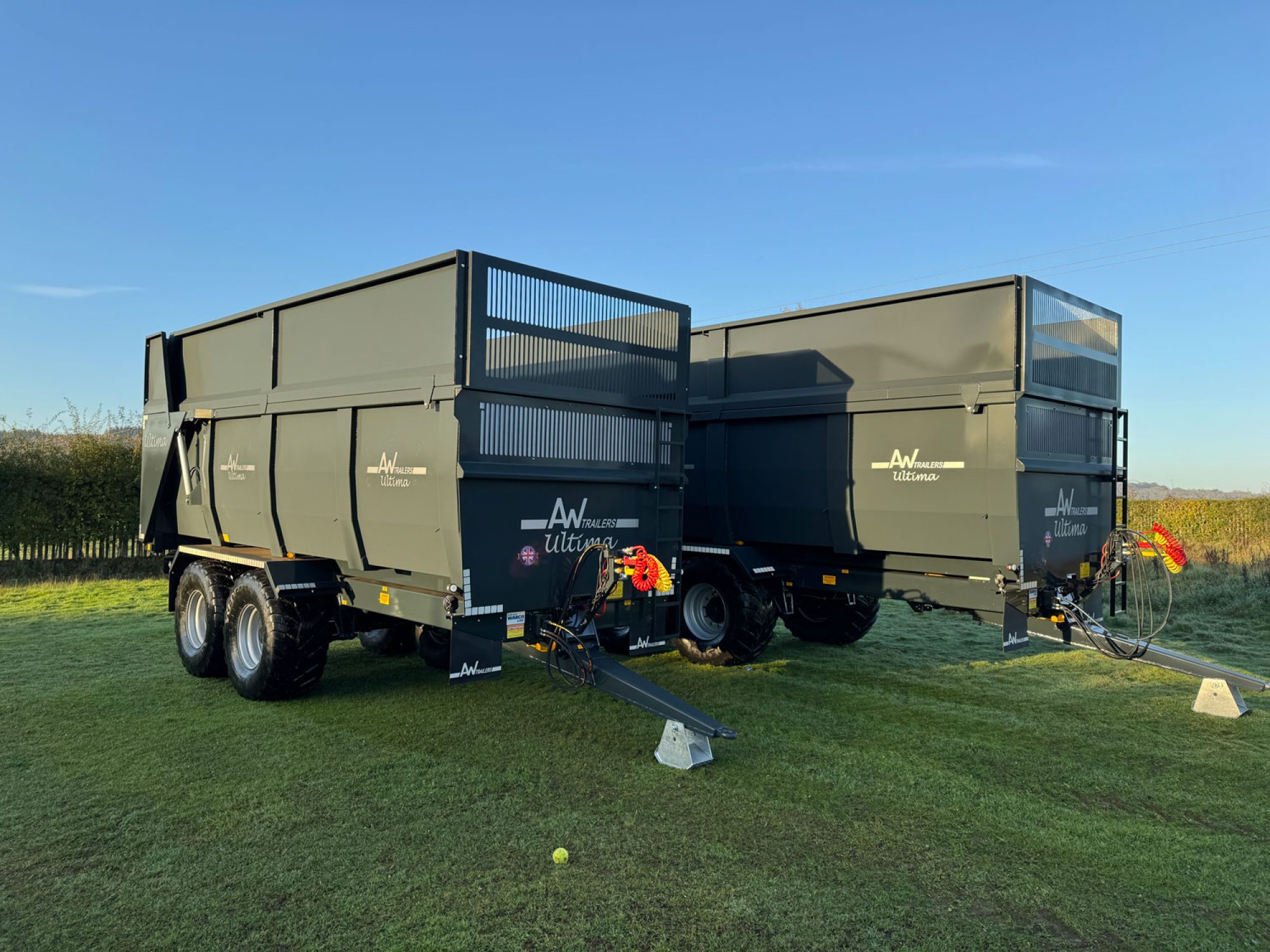 2 large grey ultima monocoque trailers in a factory carpark