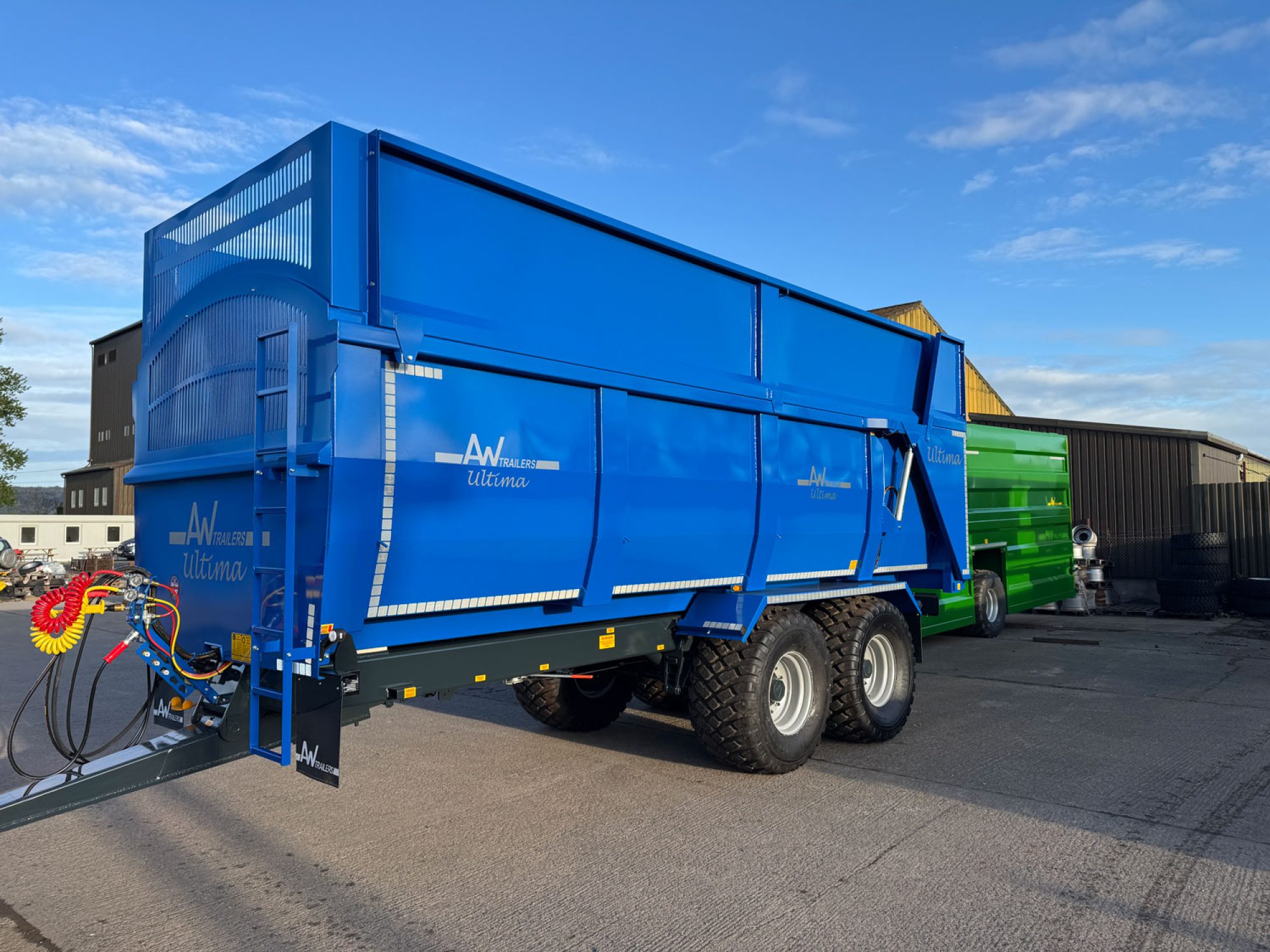 A large blue ultima monocoque trailer in a factory carpark