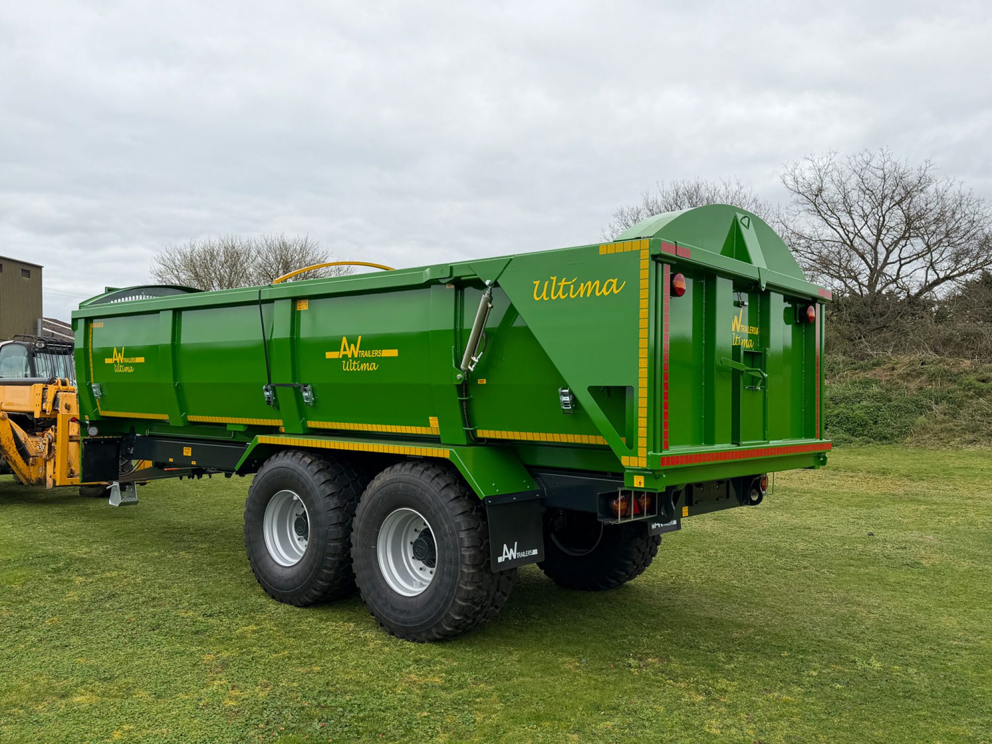 A large Ultima Potato & Root trailer in a field