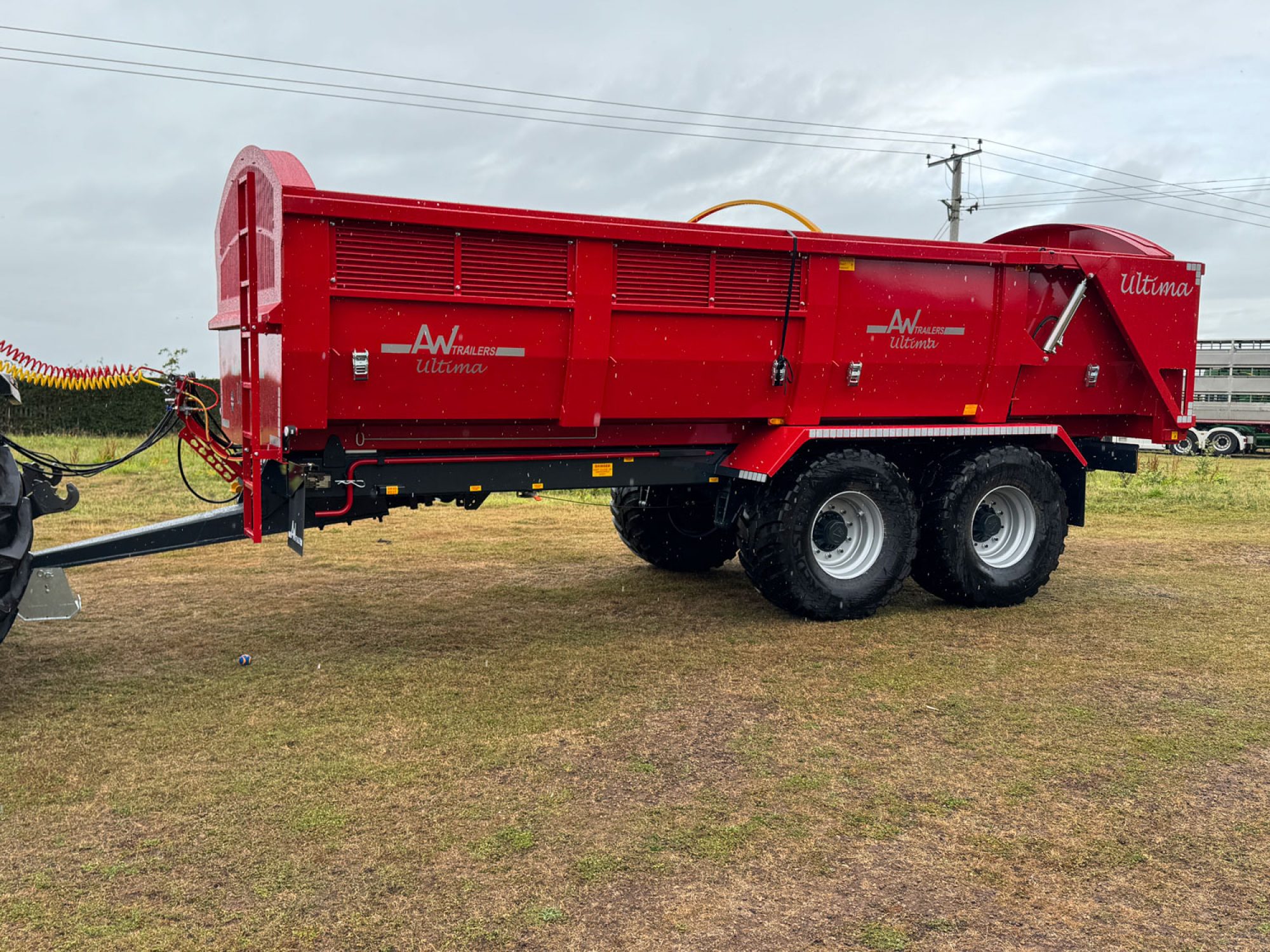 A large Ultima Potato & Root trailer in a field